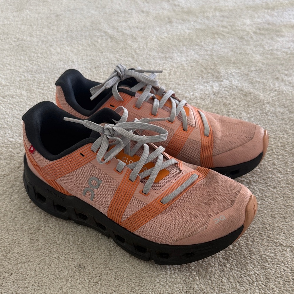 On Cloud Coral and Black Athletic Shoes
